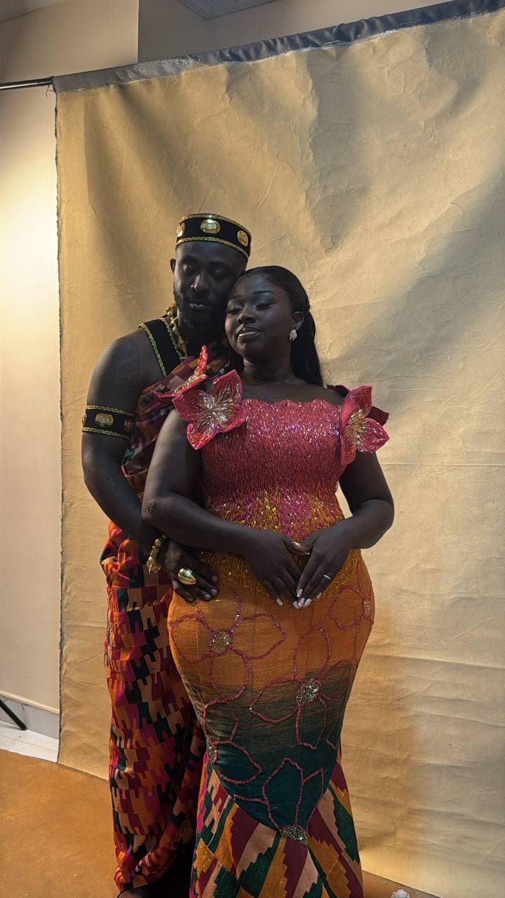 Traditional Ghanaian engagement portrait, couple in kente cloth
