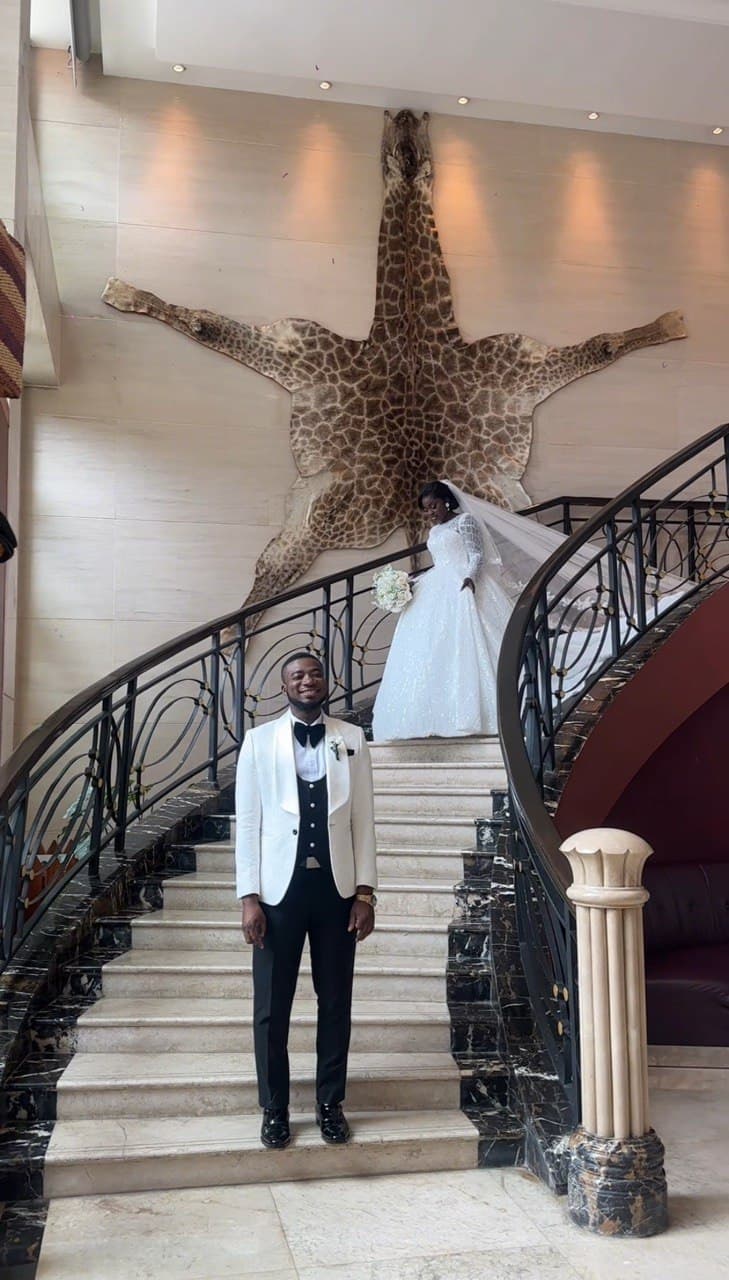 Wedding portrait, bride and groom on a grand staircase
